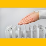 Hands warming over a radiator Shutt
